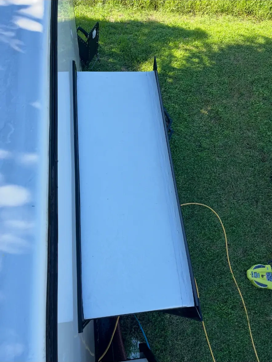 Clean white RV slide-out roof after Van-Van cleaning